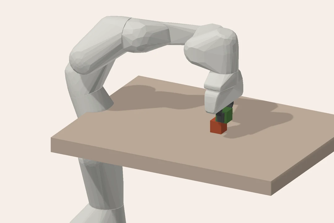A Franka Panda arm above a table holds a green cube beside a red cube.